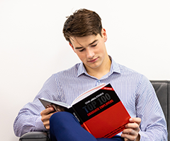 UCD student reading.